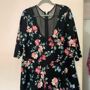 Beautiful mesh black dress with colorful flowers.